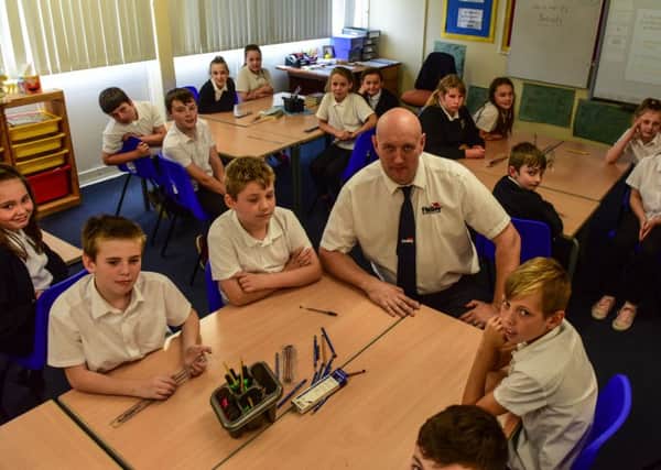 Former pupil at Toner Avenue Primary School, Hebburn, now successful  businessman Grant Findlay  with Year 6 pupils