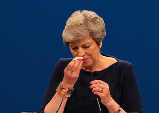 Theresa May had a tough week at the Conservative Party Conference as she battled against a cold, a comedian and letters falling off the wall display behind her.