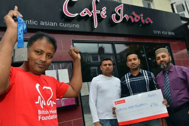 Cafe India Noor Ahmed Great North Run fundraiser for the British Heart Foundation
Staff back from left Syed Khanur Ahmed, Monir Hossain and Aminur Ahmed