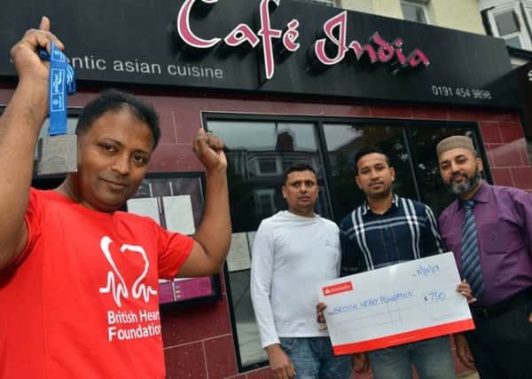 Cafe India Noor Ahmed Great North Run fundraiser for the British Heart Foundation 
Staff back from left Syed Khanur Ahmed, Monir Hossain and Aminur Ahmed