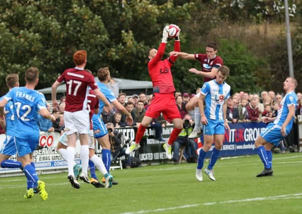 Hartlepool United goalkeeper Scott Loach claims a high ball against South Shields. Picture by Peter Talbot.