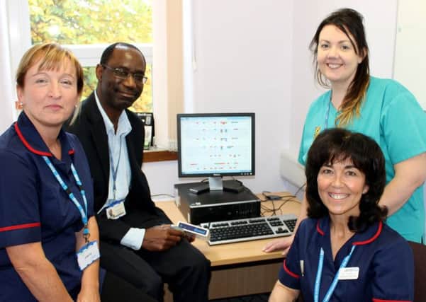 Paediatric diabetes nurses Joanne Henderson, left, and Val Campbell, seated right, with Consultant Paediatrician Dr Gabriel Okugbeni and Paediatric Speciality Doctor Faye McCorry