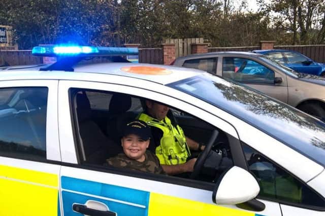 Ellis Hardy was able to sit in one of Northumbria Police's cars with its lights on as part of the visit.
