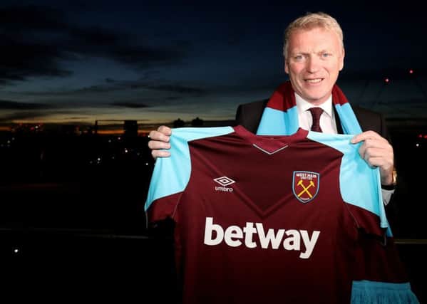 New West Ham United manager David Moyes poses with a scarf and shirt after the press conference at the London Stadium. PRESS ASSOCIATION Photo. Picture date: Wednesday November 8, 2017. See PA story SOCCER West Ham. Photo credit should read: Steven Paston/PA Wire. RESTRICTIONS: EDITORIAL USE ONLY No use with unauthorised audio, video, data, fixture lists, club/league logos or "live" services. Online in-match use limited to 75 images, no video emulation. No use in betting, games or single club/league/player publications.
