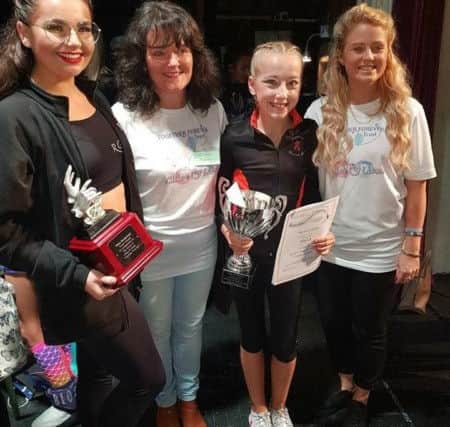 Chloe and Liam Together Forever Trust bursary winners, Jody Rafferty and Scarlett Ford  are presented their trophies by  Caren Lumsdale and Charlotte Rowe
