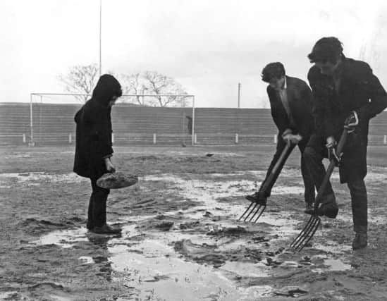 Forking the Simonside Hall pitch to get it ready for a game against Halifax Town in January 1966  are Kenneth Smith, Kenneth Sanders and Kenneth Irvin.