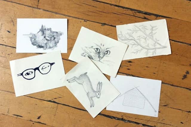 Some of the postcards that have been created by a group of emerging artists.