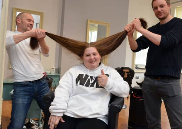 Kaley Newsome befofre she braved her haircut for the Little Princess Trust with hair dresser's Nick Greeves, left,  and Peter Marsh.
