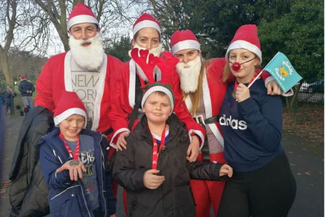 Cillian Tynan, centre, took part in the fun run with his family
