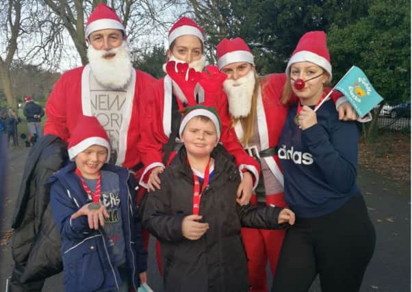 Cillian Tynan, centre, took part in the fun run with his family