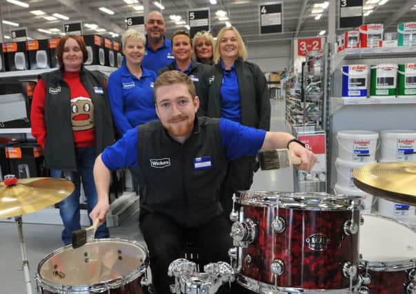 Wickes operations manager Liam Ridley, on the drums, which are the star prize in a raffle in aid of Chloe and Liam's Together Forever Trust.