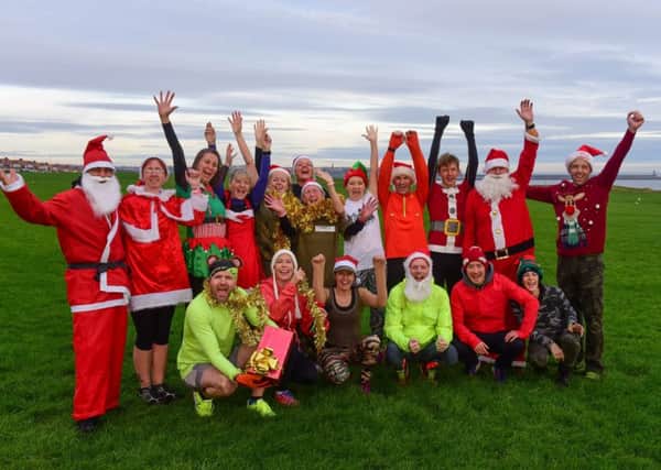 Luke Adams (2nd from right front row) and friends who are holding their annual charity Santa Fun Run next Sunday.