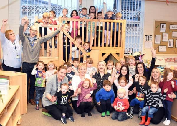 Staff and children at Sue Hedley Nursery School celebrate their "outstanding" rating from Ofsted.
