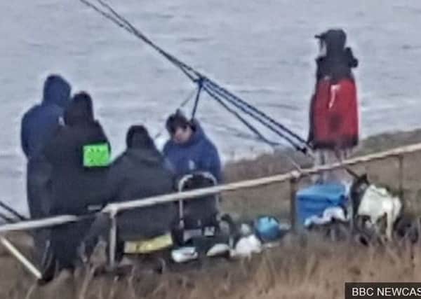 Anglers are caught on the wrong side of barriers on the cliff tops in South Tyneside. Images by BBC Newcastle