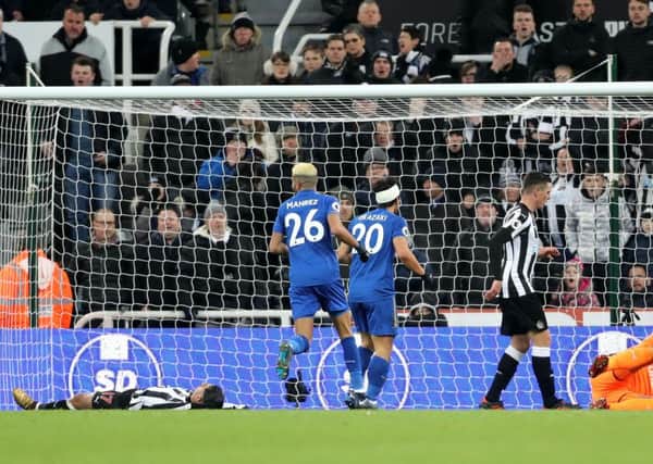 Newcastle Uniteds Ayoze Perez (left) reacts after scoring his own goal late on.