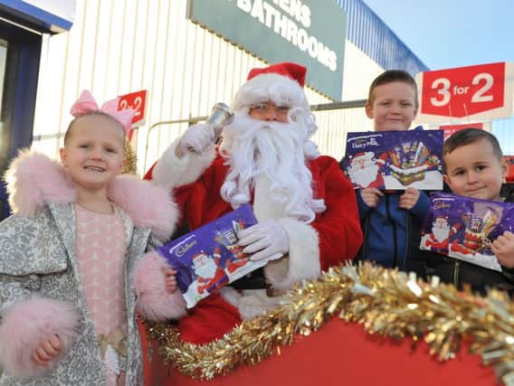 Youngsters Dakota Finn, Bobby Matthews and Brody Hancock meet Santa, during a charity day in aid of Together Forever, held at Wickes, Station Road, South Shields.