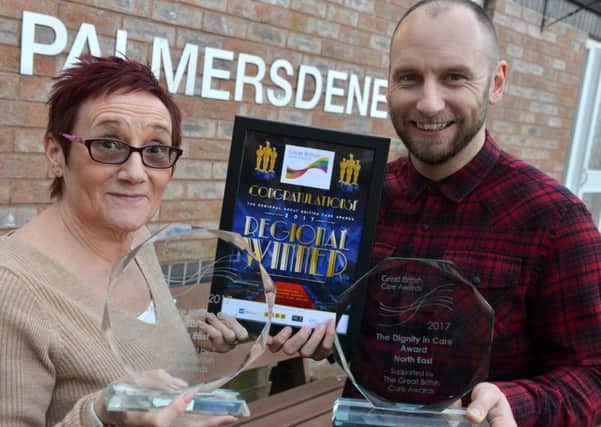 Palmersdene Care Home staff Judith Woodrych and Anthony Bage with their awards