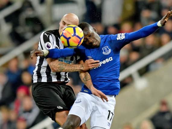 Jonjo Shelvey challenges with Idrissa Gueye