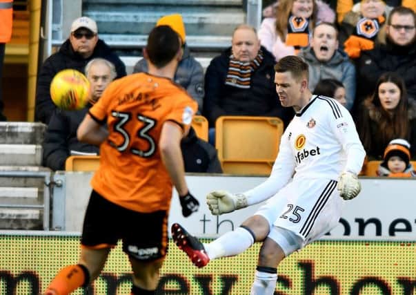 Robbin Ruiter makes a clearance at Wolves.