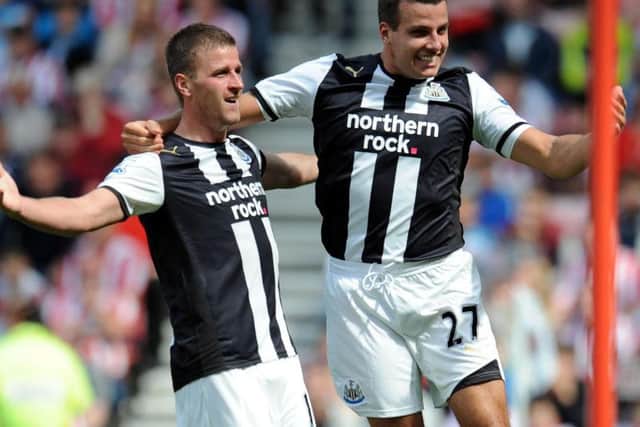 Ryan Taylor, left, and Steven Taylor celebrate a goal against Sunderland