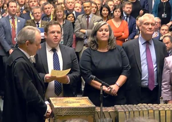 MPs return their result in the House of Commons, London, where the Government suffered its first defeat over the European Union (Withdrawal) Bill.