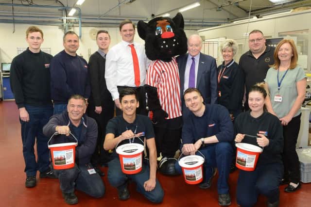 James Burman of the Foundation of Light, back row forth right, with Ford Aerospace Chairman, Geoff Ford and employees who will be backing the Beacon in 2018