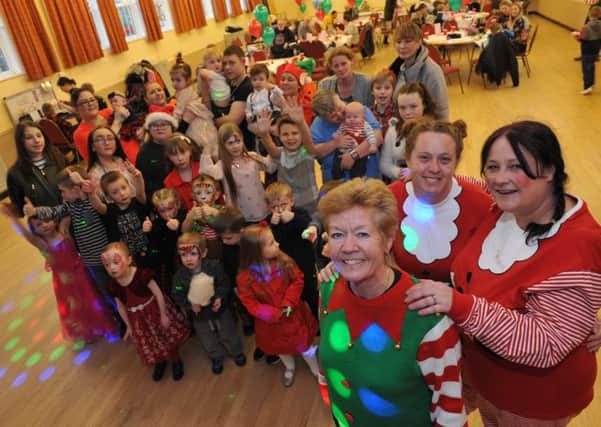 Families enjoy Hebburn Helps Christmas party at St Aloysius Church Hall, with Joan Laws, Angie Comerford and Jo Durkin.
