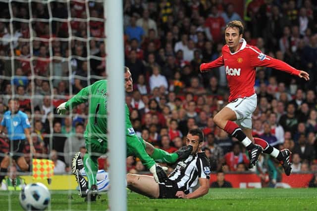 Dimitar Berbatov scores for Manchester United during their 3-0 victory over Newcastle in August 2010.