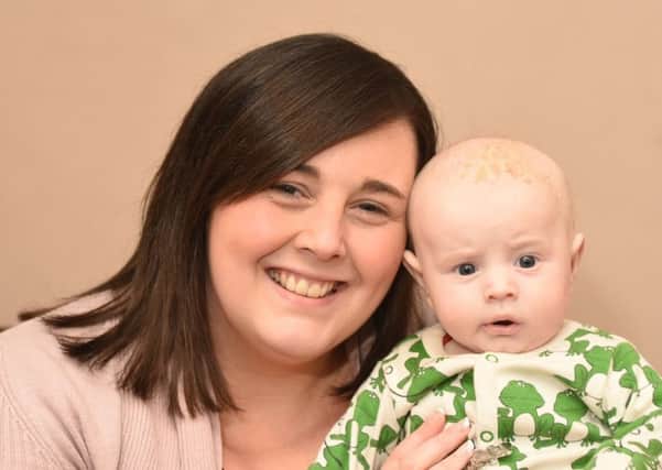Carrie Burnage with her baby Thomas
