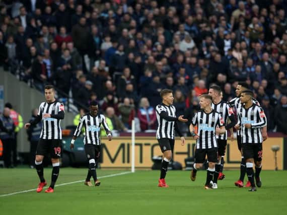 Newcastle's players celebrate Henri Saivet's goal