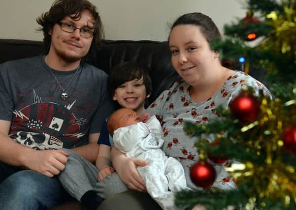 Andrew McIntosh and Ashleigh Dent with sons, five-year-old Frankie and baby Isaac.