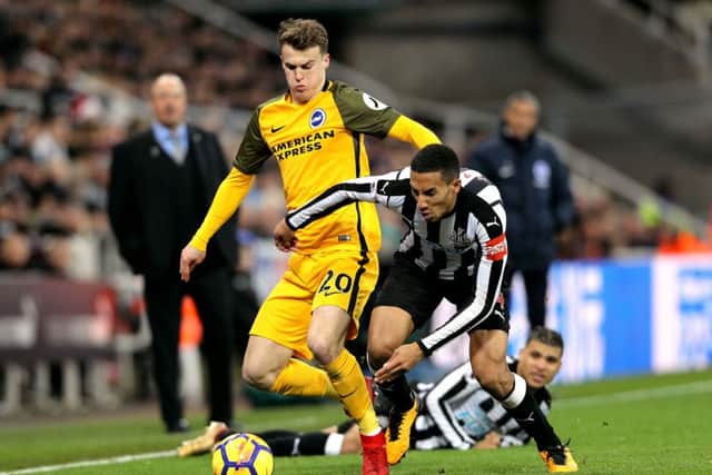 Newcastle United's Isaac Hayden battle for the ball with Brighton & Hove Albion's Solly March.