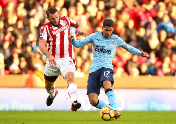 Stoke City's Erik Pieters (left) and Newcastle United's Ayoze Perez battle for the ball.
