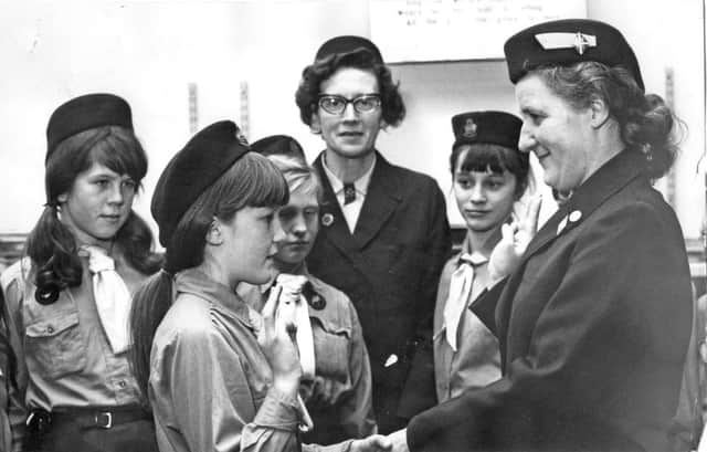Christine Pape being enrolled as a Guide with the 56th St Oswalds South Shields Company. Pictured are Guide Commissioner, Dorothy Corner. Centre, Guider Norma McNaney.