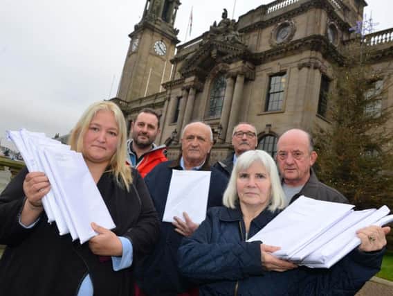Campaigners hand over a petition against the Temple Park plan.
