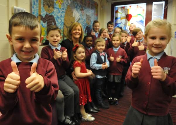 St Bede's RC Primary School, Jarrow, celebrate the schools good Ofsted report with headteacher Moya Rooney.