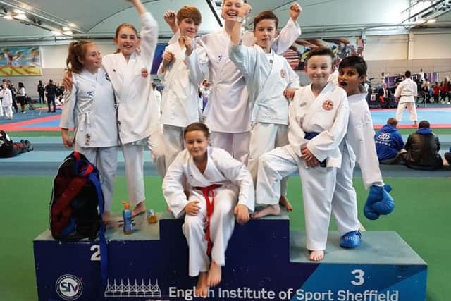 Members of Dokan celebrate after being part of the best-performing club at the North of England Karate Championship.