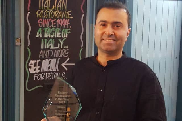 Pacinos owner Med Tarom with  the restaurants award