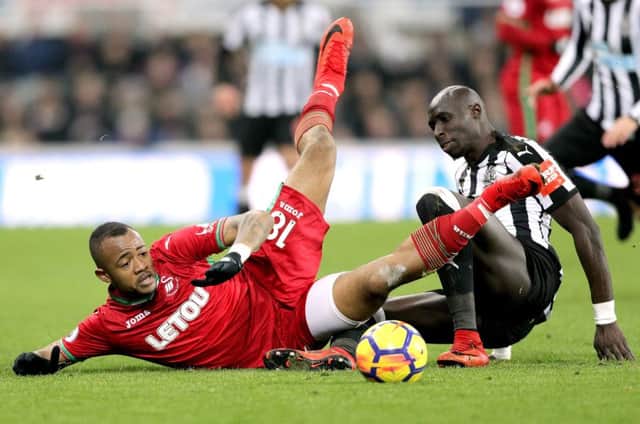 Swansea City's Jordan Ayew (left) and Newcastle United's Mohamed Diame battle for the ball during the Premier League match at St James' Park, Newcastle. PRESS ASSOCIATION Photo. Picture date: Saturday January 13, 2018. See PA story SOCCER Newcastle. Photo credit should read: Owen Humphreys/PA Wire. RESTRICTIONS: EDITORIAL USE ONLY No use with unauthorised audio, video, data, fixture lists, club/league logos or "live" services. Online in-match use limited to 75 images, no video emulation. No use in betting, games or single club/league/player publications.