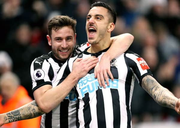 Newcastle United's Joselu (right) celebrates scoring.