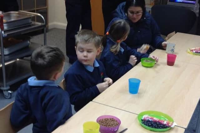 Youngsters tuck into snacks in the new Ozzie Owls room.