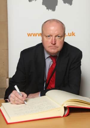 Stephen Hepburn MP signs the Holocaust Educational Trusts Book of Commitment.