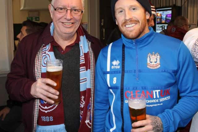 South Shields player Matty Pattison enjoys a pint and a chat with a fan. Pic: Peter Talbot