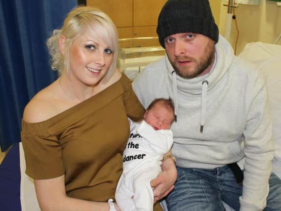 Proud parents Jodie Pearce and Jonny Thomas with new baby Lucas.