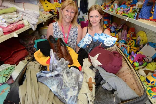 Cheryl McDonald and Lynne Davis with Joe McElderry clothes for a fundraising auction in 2015.