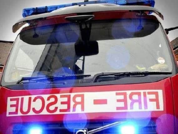 Firefighters free a casualty from a vehicle in Cleadon.