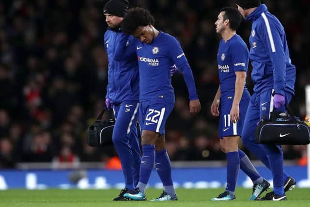 Willian limps off against Arsenal