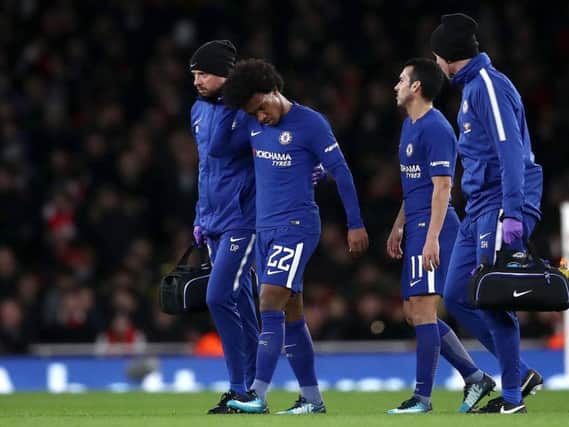 Willian limps off against Arsenal