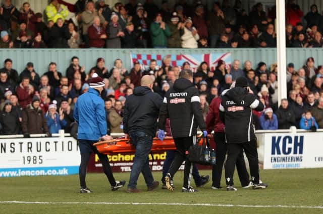 Carl Finnigan is given a standing ovation as he is stretchered off on Saturday. Picture by Peter Talbot.