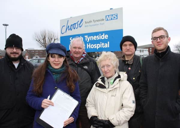 Green Party deputy leader Amelia Womack (in blue hat) along with other party activists outside South Tyneside District Hospital.
